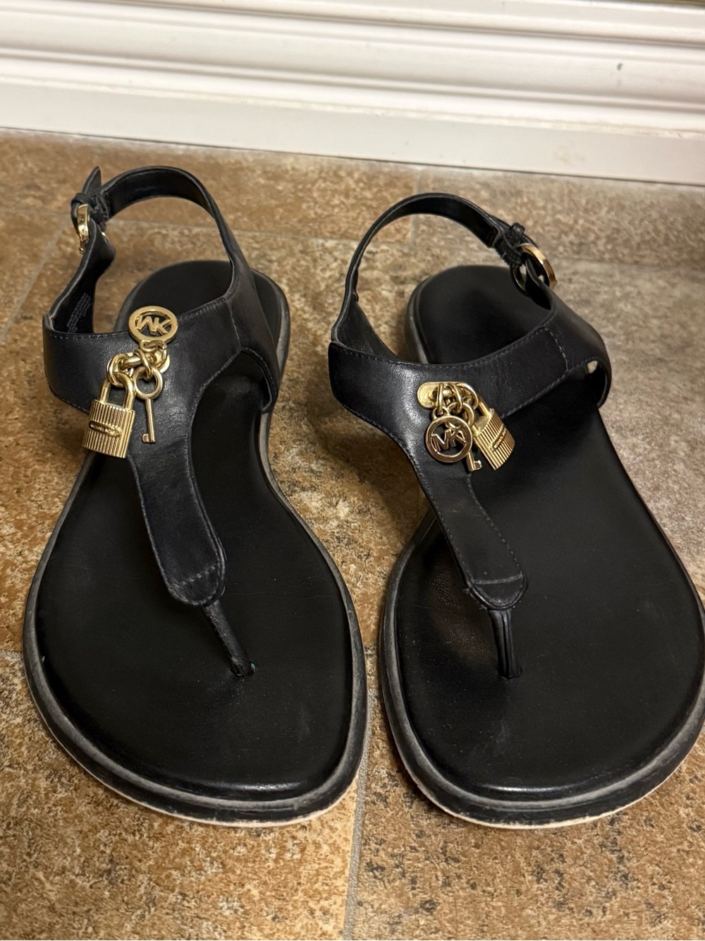 Michael Kors Black Leather T-Strap Sandals with Gold Charm Accents
